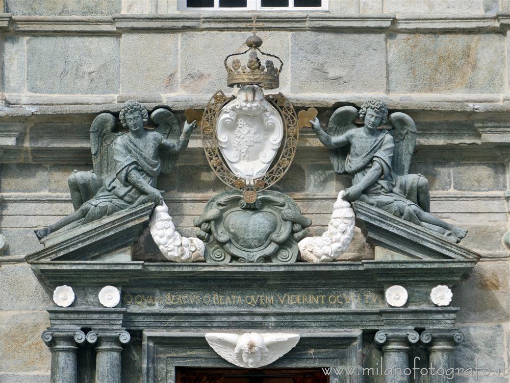 Biella (Italy) - Fronton of the door  of the Ancient Basilica of the Santuary of Oropa